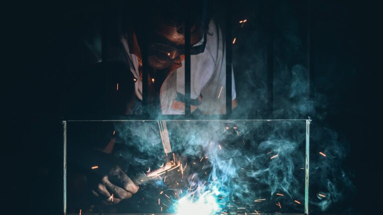 man in black jacket holding a stick